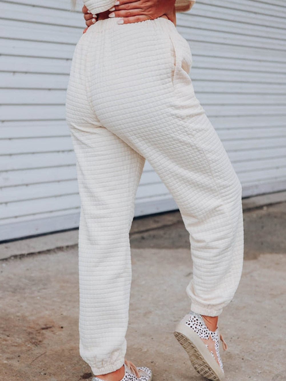 Chic White Textured Lattice Crop Top and Jogger Pants Ensemble