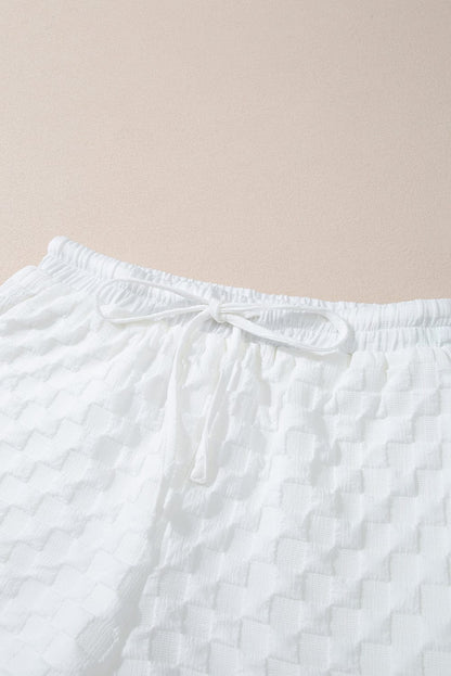 Chic White Textured V-Neck Top and Drawstring Shorts Ensemble